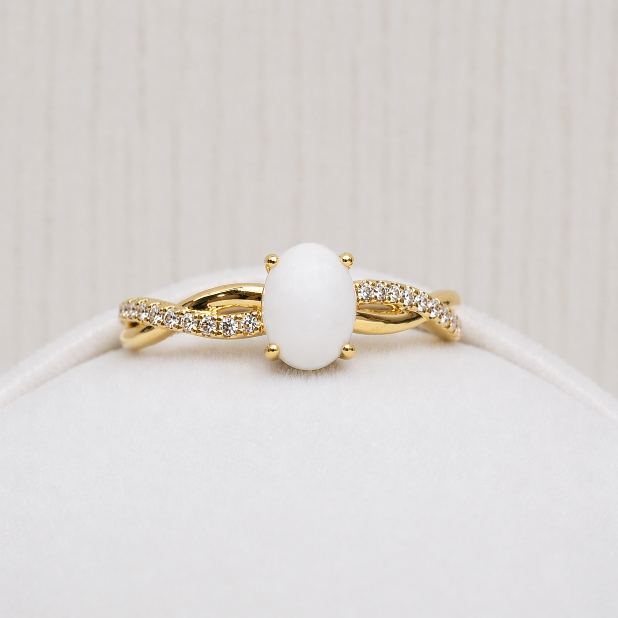 Infinity ring in Yellow gold, white stone