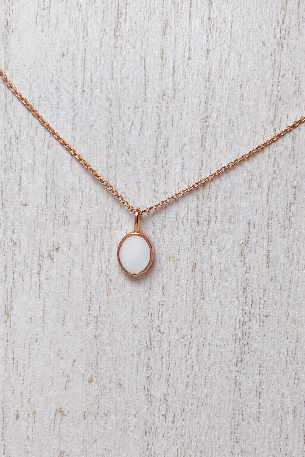 Pendentif Apodis Or rose, pierre blanche