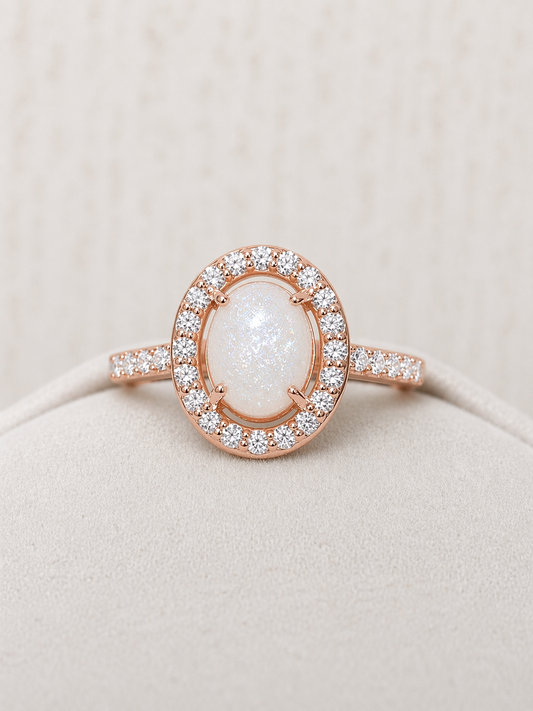 Halo ring in Rose gold, oval shaped with sparkling stone