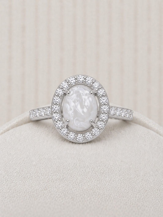 Halo ring in White gold, oval shaped with pearled stone