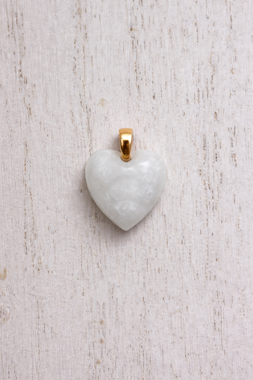 Maia heart shaped in Yellow Gold, white stone