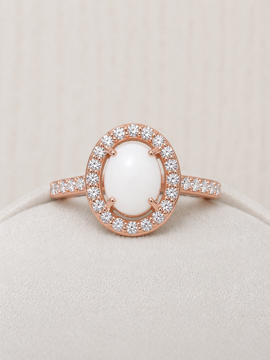 Halo ring in Rose gold, oval shaped with white stone