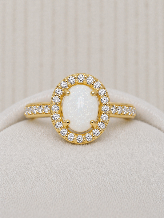 Halo ring in Yellow gold, oval shaped with natural stone