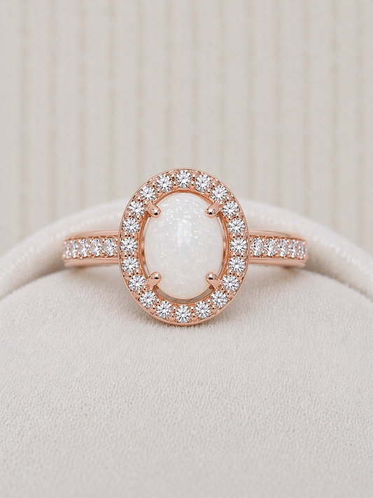 Halo ring in Rose gold, oval shaped with natural stone